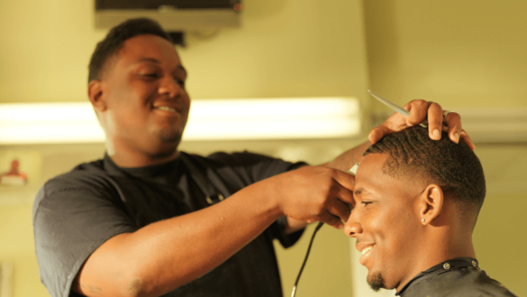 Illustration of a barber’s scissors and comb against a backdrop of the Chicago skyline.